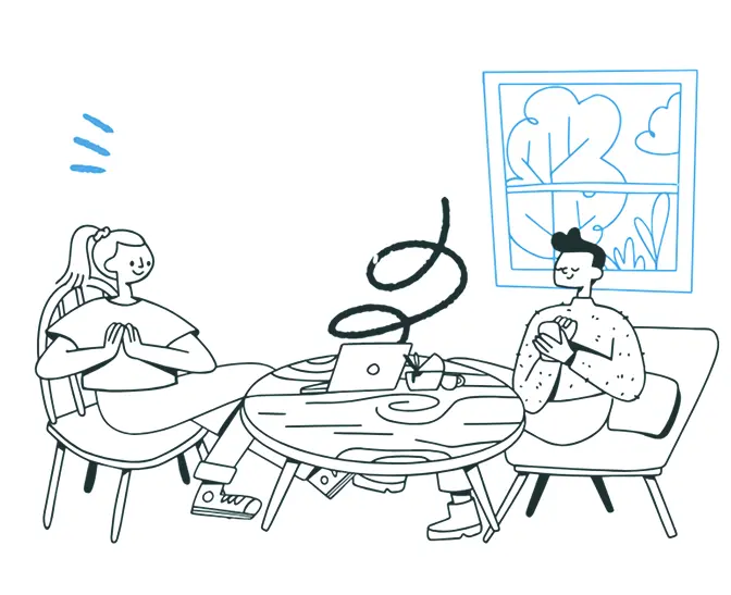 שני אנשים יושבים בשולחן מדברים.